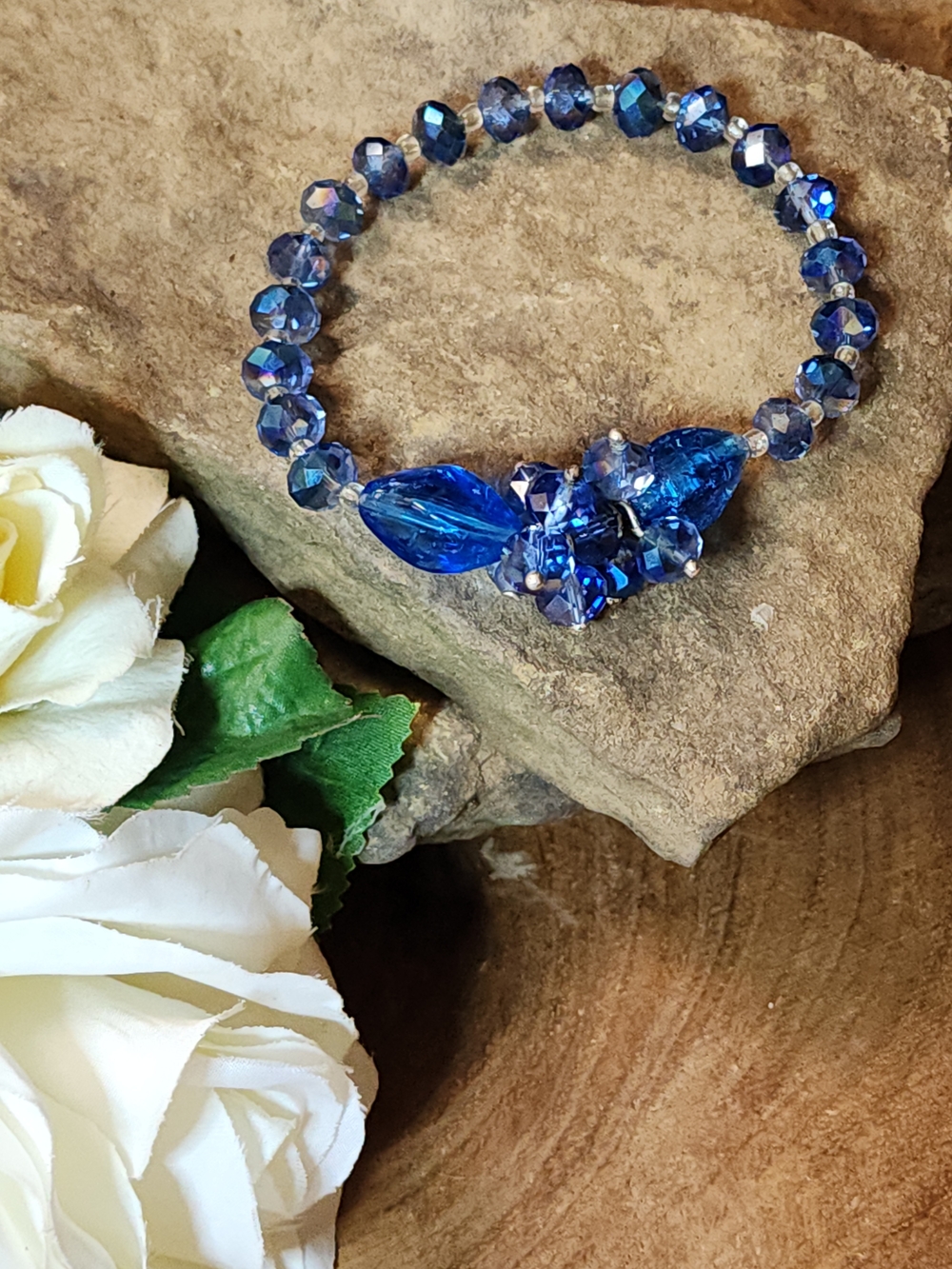 Elegant blue and clear beaded stretch bracelet with faceted glass crystal beads